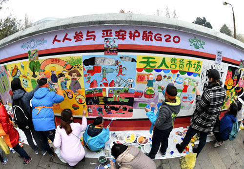 杭州小画家墙绘迎峰会(图)